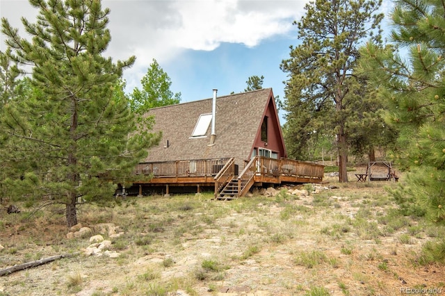 244 Lariat Loop, Hartsel, CO 80449 - back of property with roof with shingles and a deck
