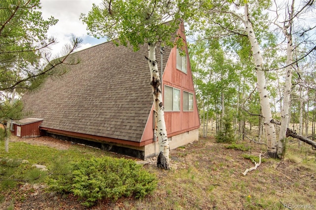 244 Lariat Loop, Hartsel, CO 80449 - view of side of property featuring a shingled roof and a storage unit