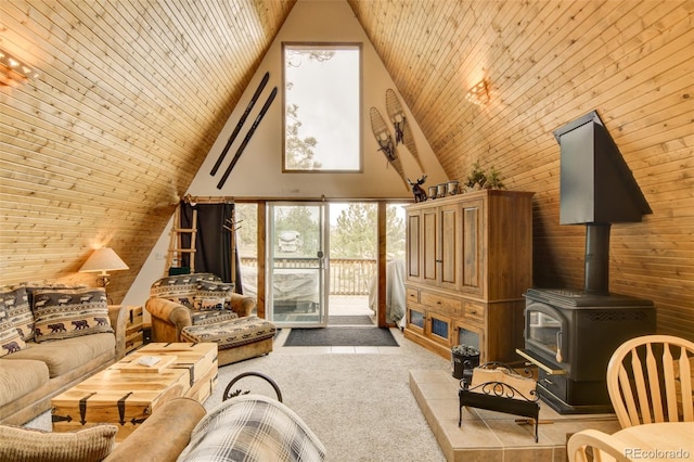 244 Lariat Loop, Hartsel, CO 80449 - carpeted living room with a wood stove, high vaulted ceiling, wood walls, and wood ceiling