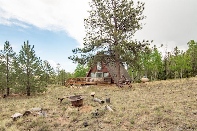 244 Lariat Loop, Hartsel, CO 80449 - view of yard featuring a fire pit and a wooden deck