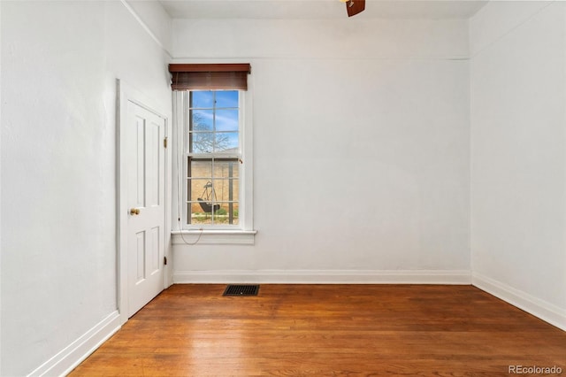 1748 S Logan St, Denver, CO 80210 - unfurnished room with wood finished floors, baseboards, and a ceiling fan