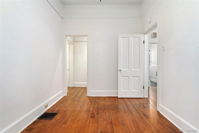 1748 S Logan St, Denver, CO 80210 - unfurnished bedroom with wood finished floors and baseboards