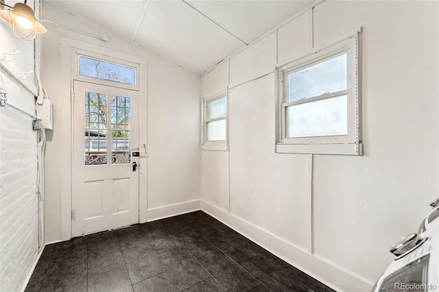 1748 S Logan St, Denver, CO 80210 - doorway featuring plenty of natural light, vaulted ceiling, and baseboards