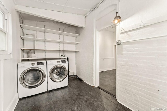 1748 S Logan St, Denver, CO 80210 - laundry area featuring washer and dryer and baseboards
