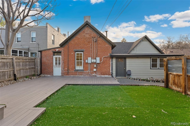 1748 S Logan St, Denver, CO 80210 - rear view of property featuring brick siding and a wooden deck