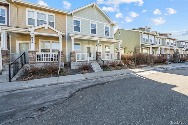 townhome / multi-family property featuring a porch