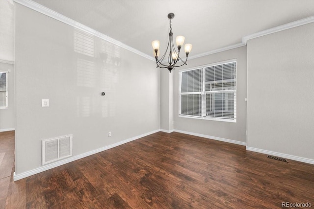 unfurnished room with a notable chandelier, dark wood-type flooring, and ornamental molding