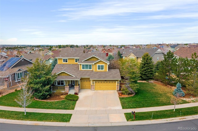 25362 E Indore Dr, Aurora, CO 80016 - craftsman-style home featuring a residential view, concrete driveway, a front yard, and an attached garage