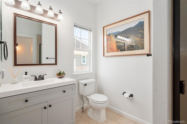 25362 E Indore Dr, Aurora, CO 80016 - bathroom featuring toilet, baseboards, vanity, and tile patterned flooring