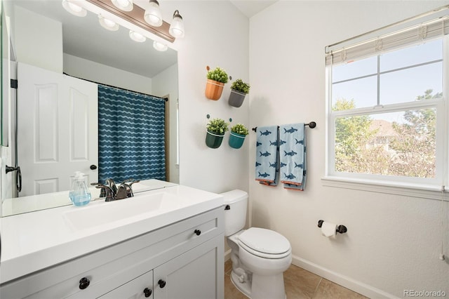 25362 E Indore Dr, Aurora, CO 80016 - full bath with toilet, baseboards, vanity, tile patterned floors, and a shower with curtain