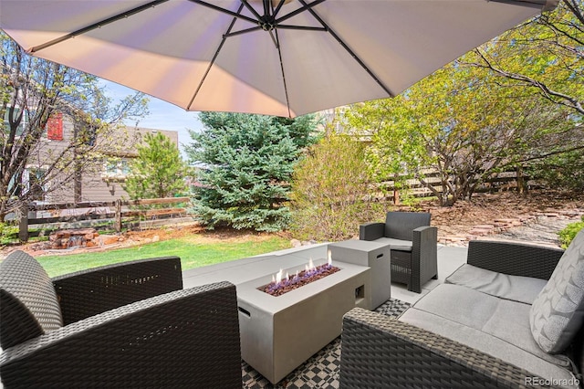 25362 E Indore Dr, Aurora, CO 80016 - view of patio with an outdoor living space with a fire pit and fence