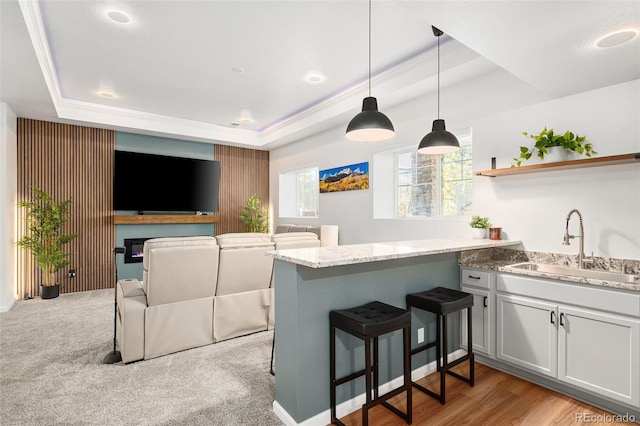 25362 E Indore Dr, Aurora, CO 80016 - kitchen featuring a raised ceiling, a peninsula, open floor plan, and open shelves