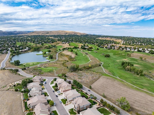 birds eye view of property with a water and mountain view