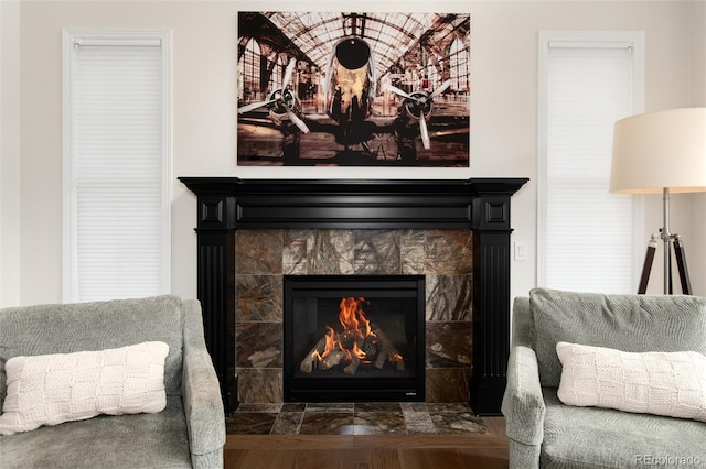 sitting room with a tile fireplace