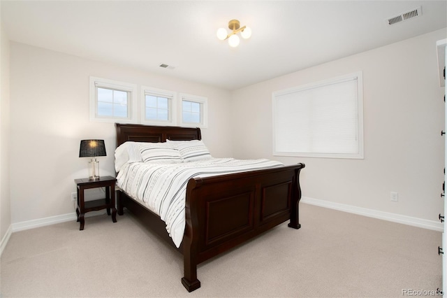 bedroom featuring light carpet