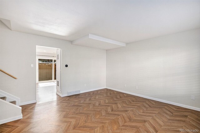 empty room with stairs and baseboards