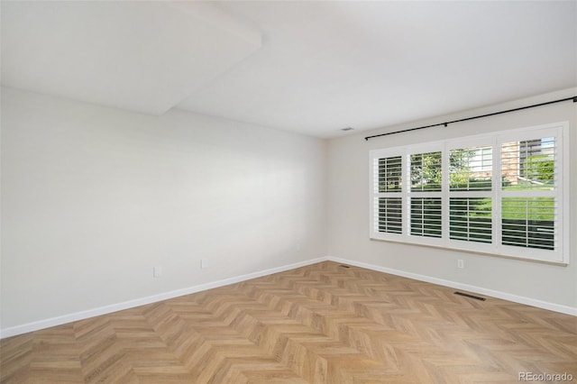 empty room with baseboards