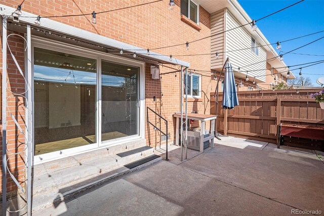 view of patio / terrace with entry steps and fence