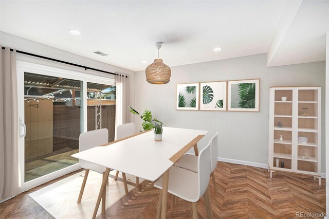 dining space with baseboards and recessed lighting