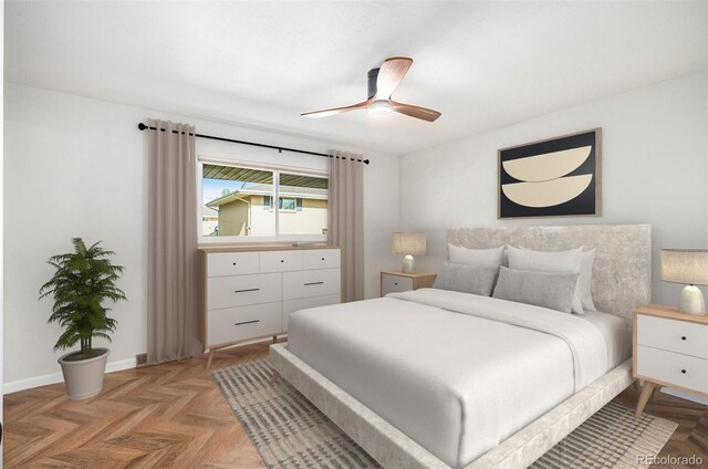 bedroom featuring ceiling fan and baseboards