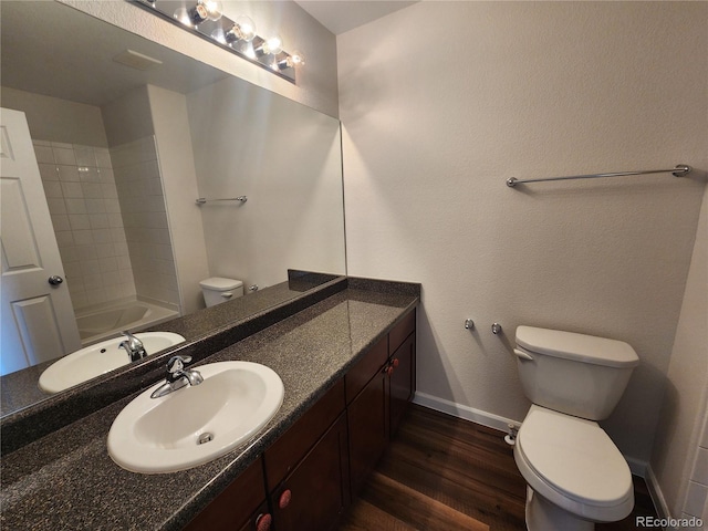 full bath with vanity, toilet, baseboards, and wood finished floors