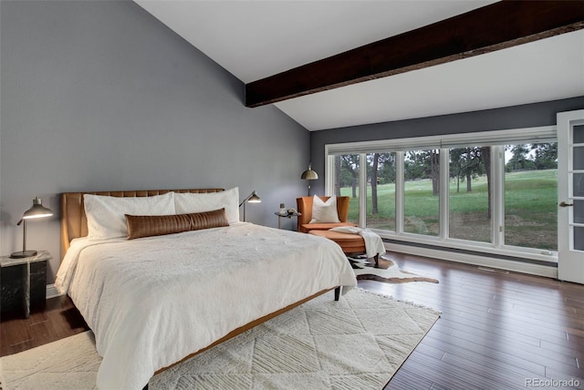 bedroom featuring vaulted ceiling with beams and wood finished floors