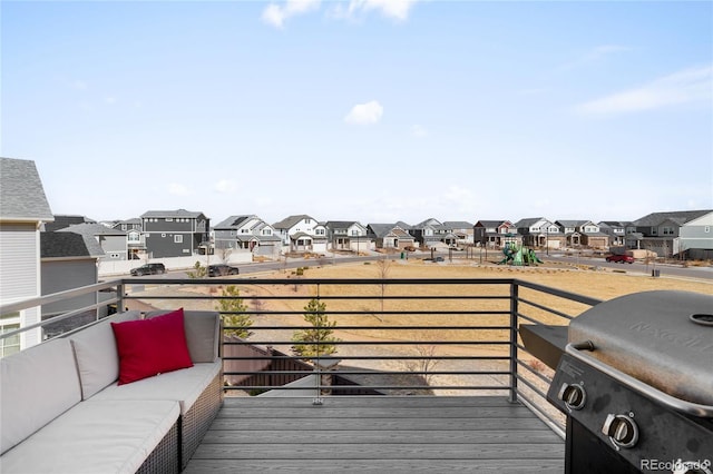 21925 E 44th Pl, Aurora, CO 80019 - wooden terrace featuring a residential view, a grill, and an outdoor hangout area