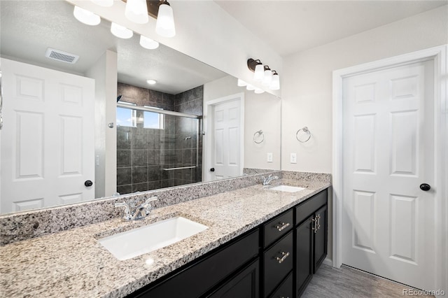 21925 E 44th Pl, Aurora, CO 80019 - full bath featuring double vanity and a stall shower