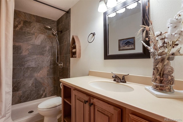 120 Red Rock Ct, Woodland Park, CO 80863 - bathroom featuring toilet, vanity, and a tile shower