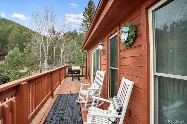 120 Red Rock Ct, Woodland Park, CO 80863 - wooden terrace with a forest view