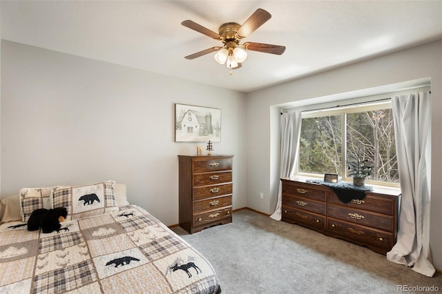 120 Red Rock Ct, Woodland Park, CO 80863 - bedroom with light colored carpet, ceiling fan, and baseboards