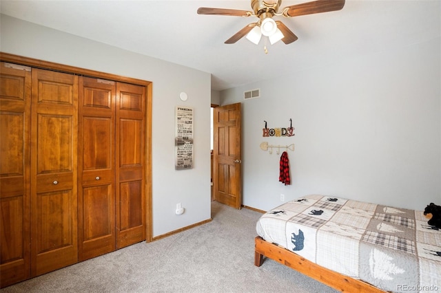 120 Red Rock Ct, Woodland Park, CO 80863 - bedroom featuring light colored carpet, baseboards, a closet, and ceiling fan