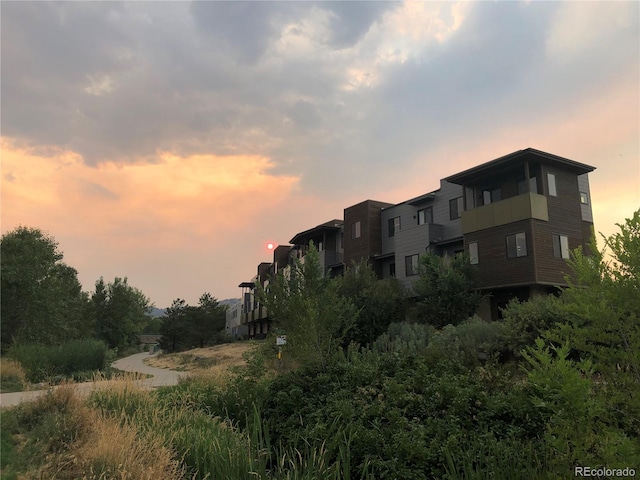 view of outdoor building at dusk