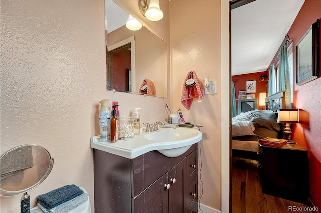 bathroom with vanity and hardwood / wood-style flooring