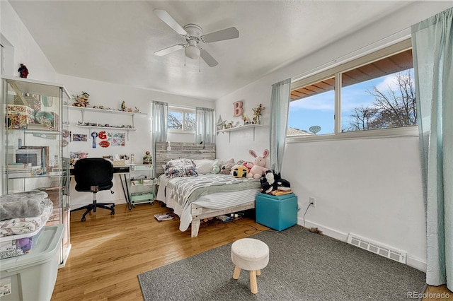 bedroom featuring hardwood / wood-style flooring and ceiling fan