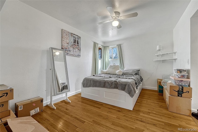 bedroom featuring hardwood / wood-style floors and ceiling fan