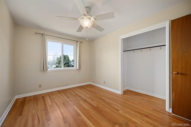 unfurnished bedroom featuring baseboards, a ceiling fan, light wood-style floors, and a closet
