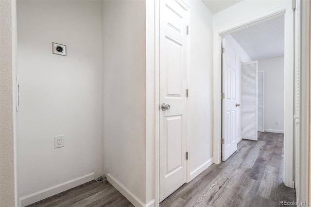 hallway with wood-type flooring