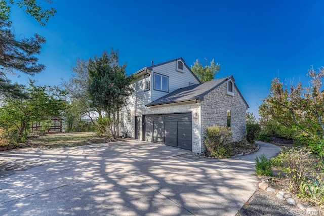 view of side of home with a garage