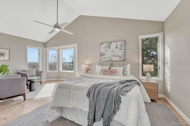 bedroom with light wood-type flooring, ceiling fan, and lofted ceiling