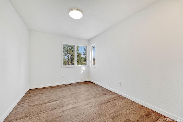 unfurnished room featuring light wood-type flooring