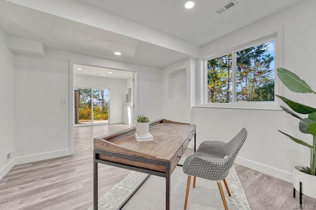 office space with light wood-type flooring