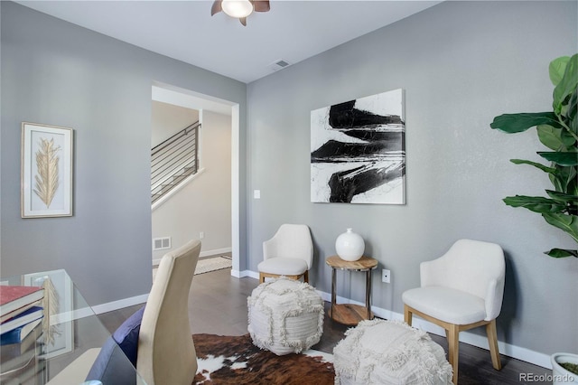 sitting room featuring dark wood-type flooring