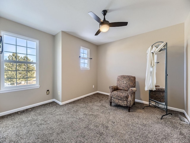 unfurnished room with carpet flooring and ceiling fan