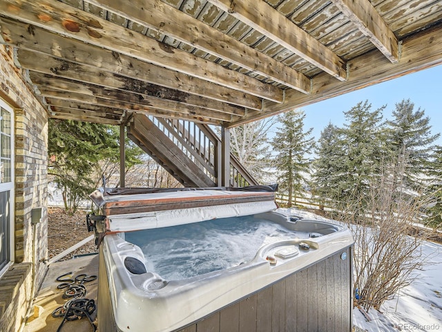 exterior space with a hot tub