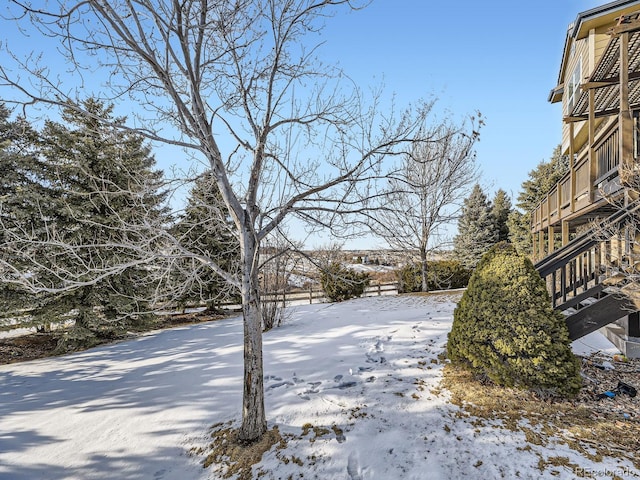 view of yard layered in snow