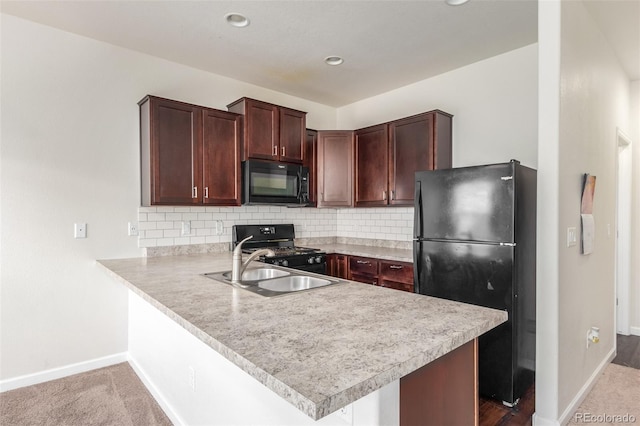 kitchen with sink, backsplash, black appliances, light colored carpet, and kitchen peninsula