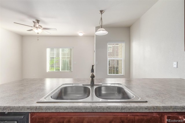 kitchen with pendant lighting, sink, and ceiling fan