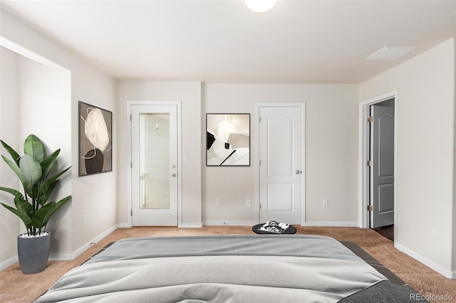 bedroom with light colored carpet