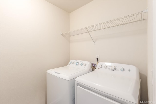 washroom featuring independent washer and dryer